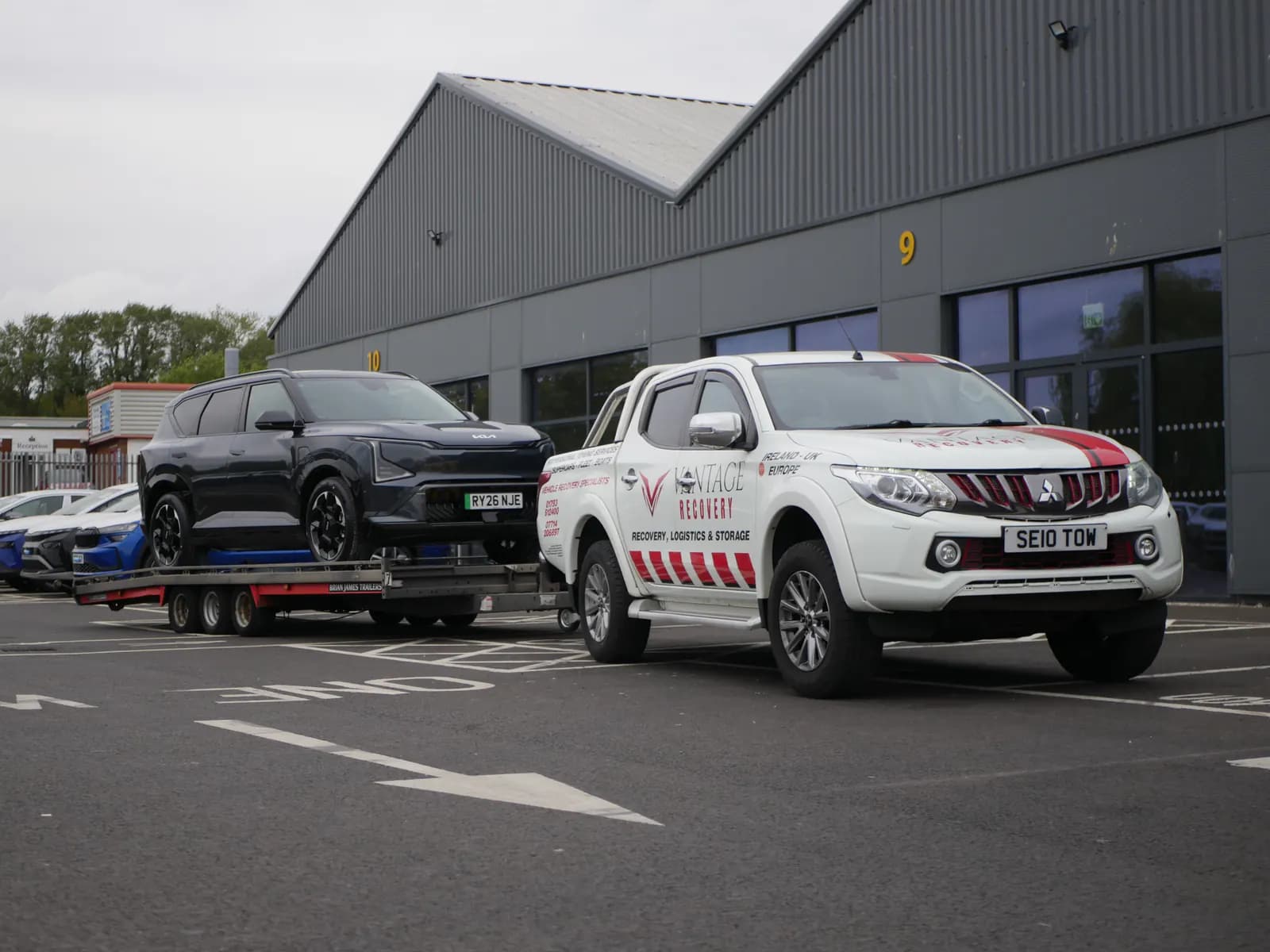 Vehicle on a transporter ready for door-to-door delivery